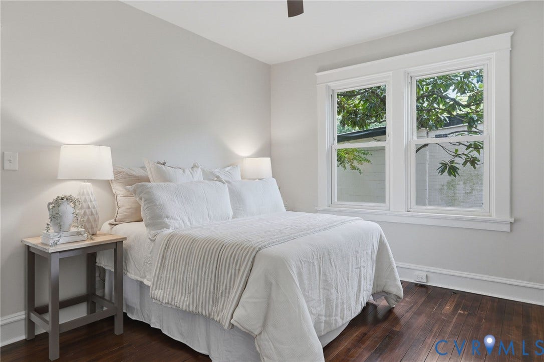 1815 Carlisle Avenue, Richmond, VA 23231 Hardwood flooring, dual windows with white trim, a ceiling fan, and light-colored wall paint