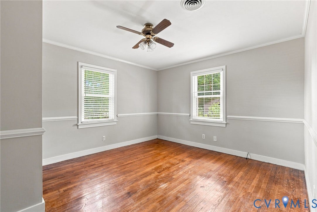 2707 Academy Road, Powhatan, VA 23139 Hardwood flooring, crown molding, chair rail molding, ceiling fan with light fixture, and two windows