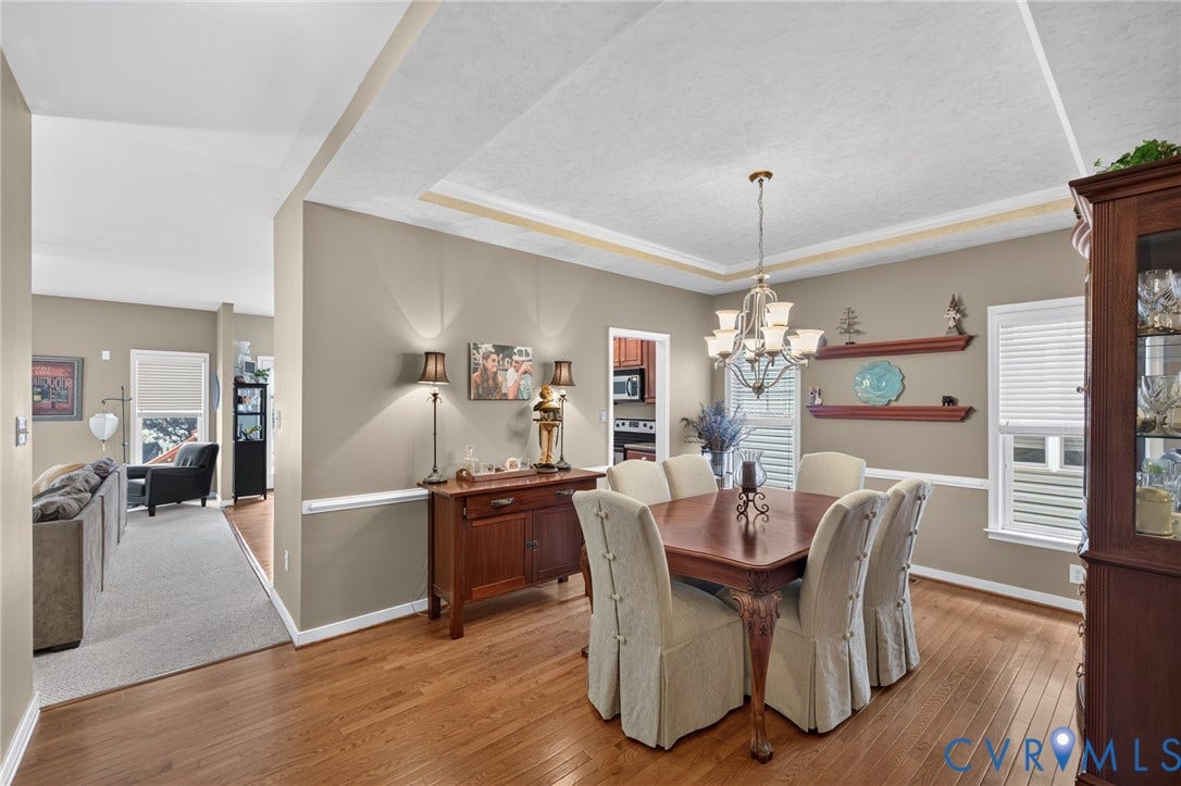 937 Gorham Court, Midlothian, VA 23114 Elegant formal dining room featuring hardwood flooring, a coffered ceiling with recessed lighting, and neutral wall finishes accented with a chair rail