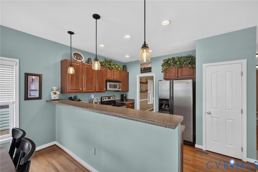 937 Gorham Court, Midlothian, VA 23114 Kitchen featuring wood flooring, recessed lighting, and pendant lights and pantry.