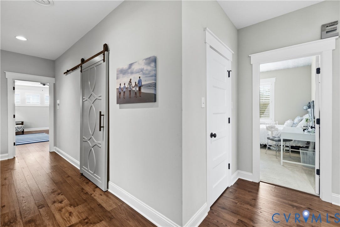 16206 Mitchells Mill Court, Midlothian, VA 23112 Upper hall with hardwoods and decorate barn door to convenient laundry room.