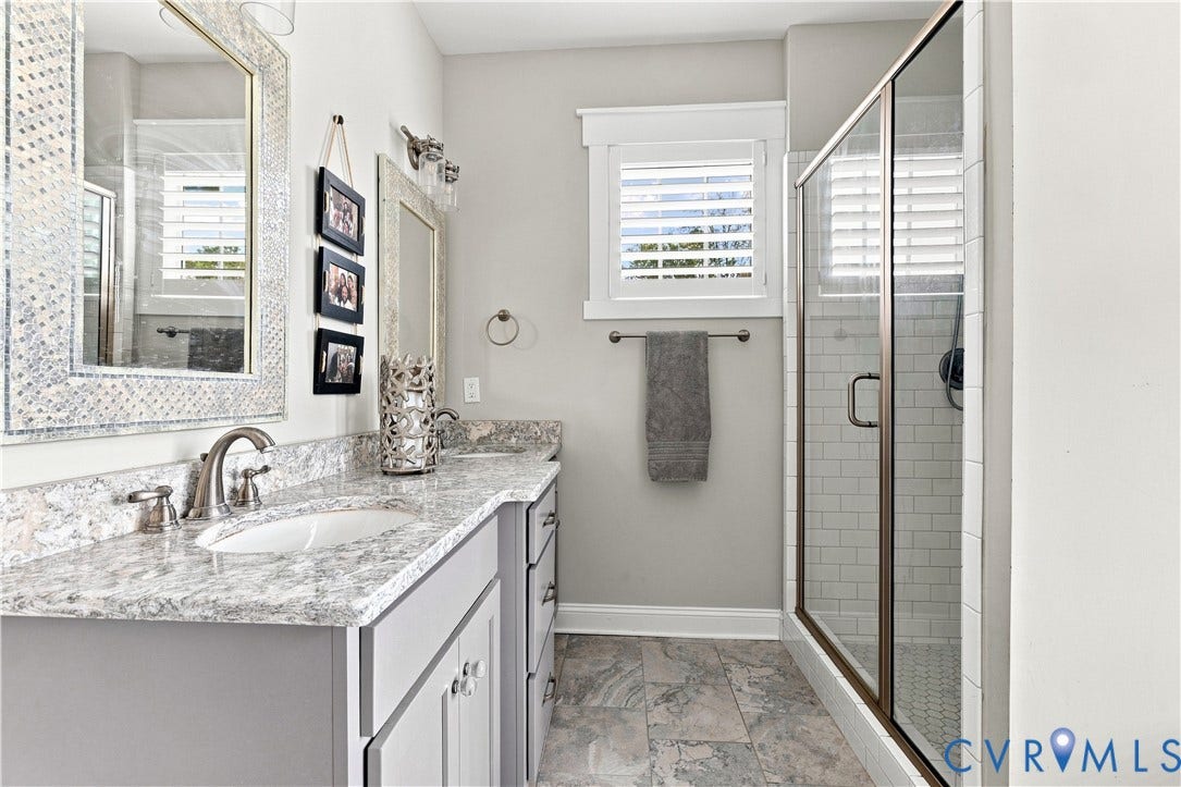 16206 Mitchells Mill Court, Midlothian, VA 23112 Dual vanity with undermount sinks and private shower with bench seat.