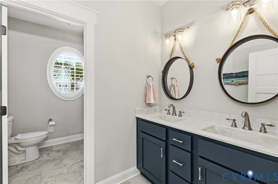 16206 Mitchells Mill Court, Midlothian, VA 23112 Hall bathroom with double vanity and separate toilet/shower space.