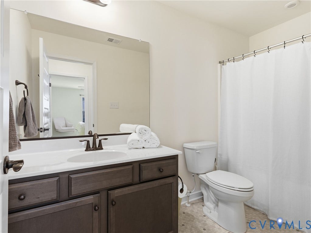 9220 Cerulean Place, Mosaic At West Creek, Goochland, VA 23238 Dark wood-finish vanity with a white countertop and integrated sink