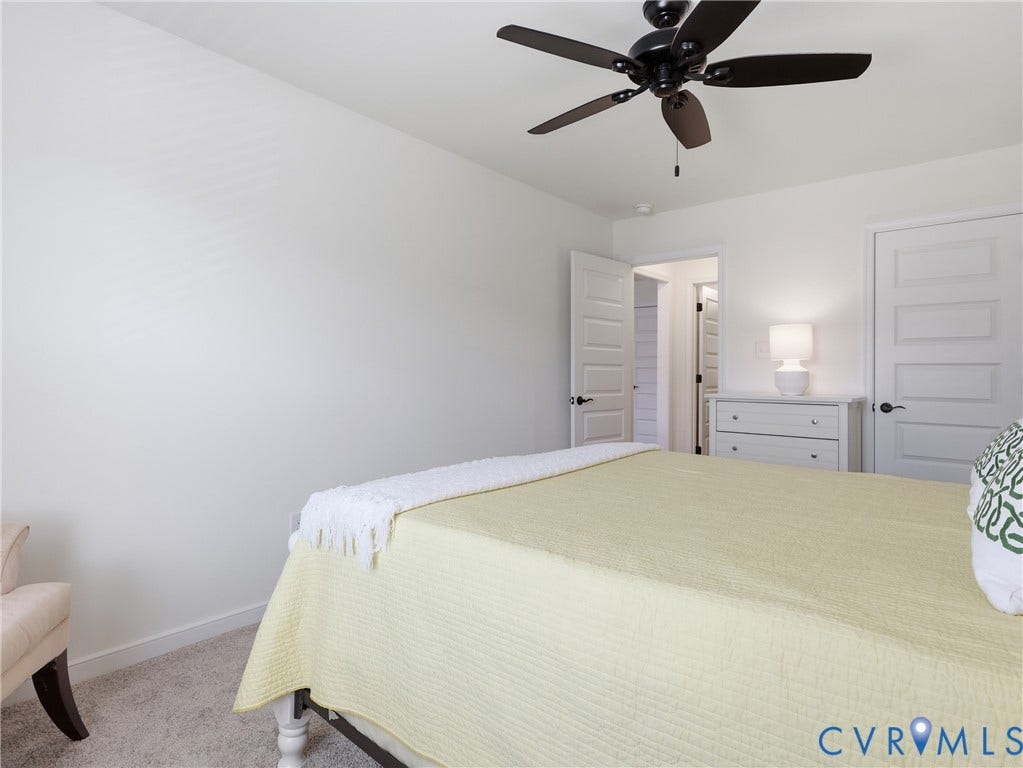9220 Cerulean Place, Mosaic At West Creek, Goochland, VA 23238 Neutral wall color, ceiling fan, paneled interior doors, and plush carpet
