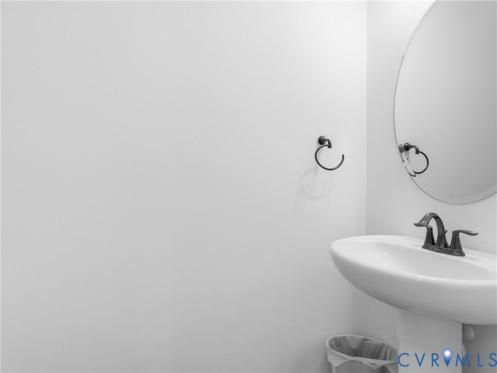 9220 Cerulean Place, Mosaic At West Creek, Goochland, VA 23238 Pedestal sink with dark-toned fixtures and a matching towel ring