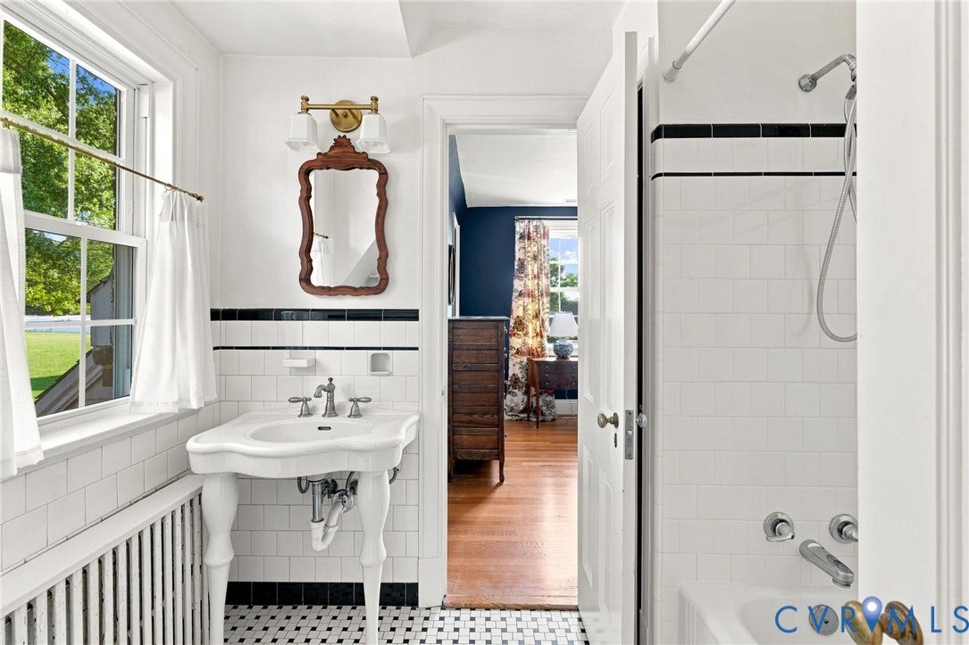 7134 Messer Road, Henrico, VA 23231 White subway tile, pedestal sink, mosaic tile flooring, and a shower/tub combination