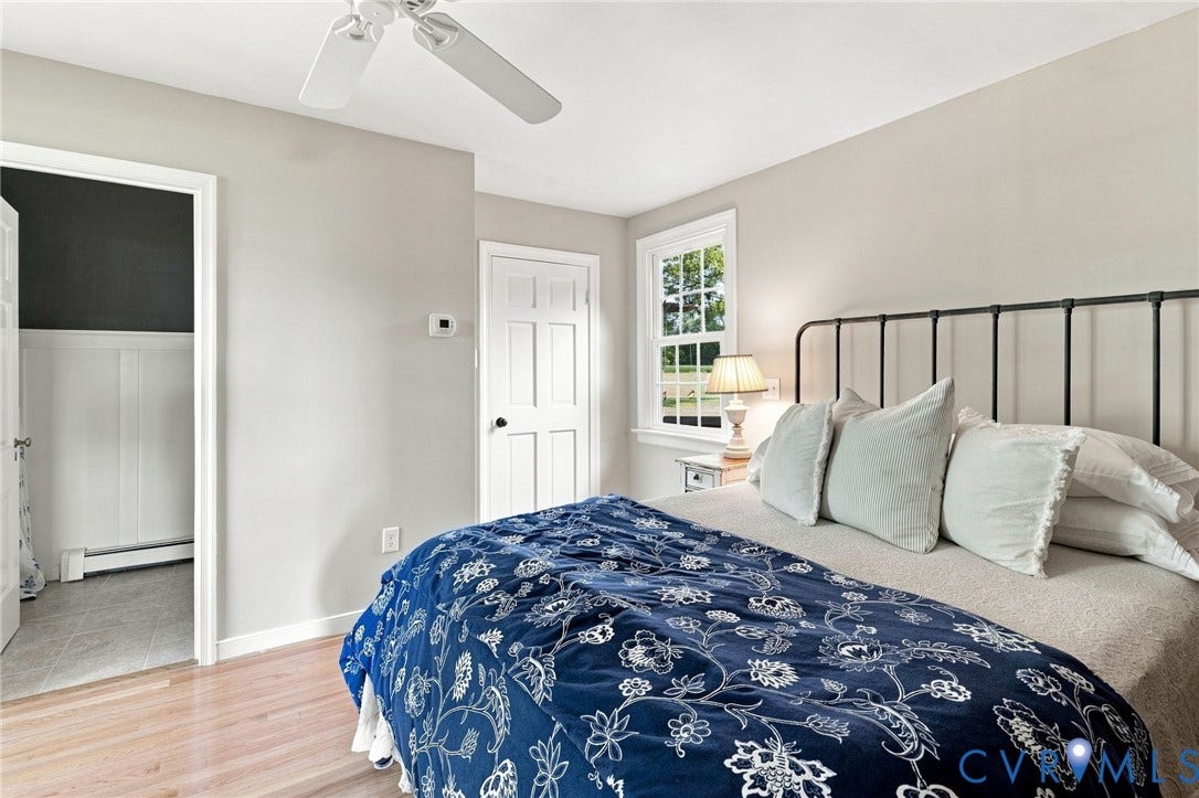 7134 Messer Road, Henrico, VA 23231 Hardwood flooring, white trim, and a ceiling fan
