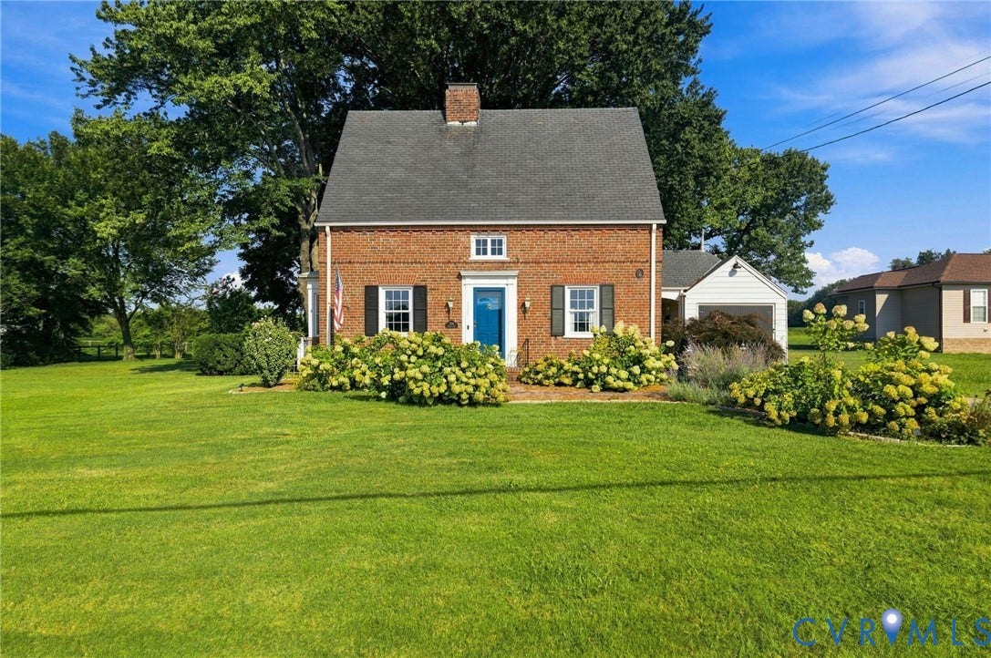 7134 Messer Road, Henrico, VA 23231 Brick exterior with a gabled roof and white window trim