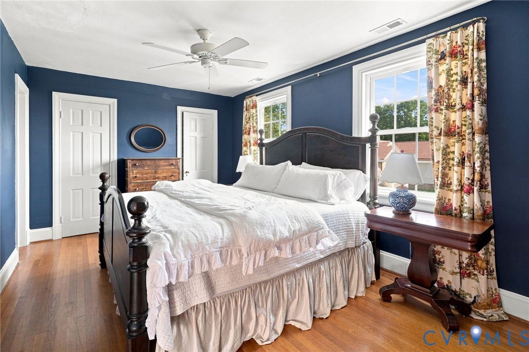 7134 Messer Road, Henrico, VA 23231 Hardwood flooring, painted walls, two paneled doors, and a ceiling fan