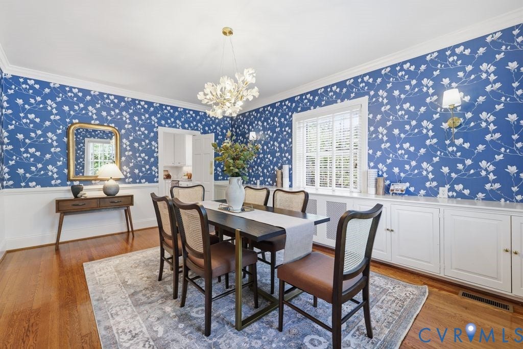 4117 W Franklin Street, Malvern Gardens, Richmond, VA 23221 Hardwood flooring, crown molding, a decorative chandelier, built-in cabinetry with a countertop, and a window with blinds