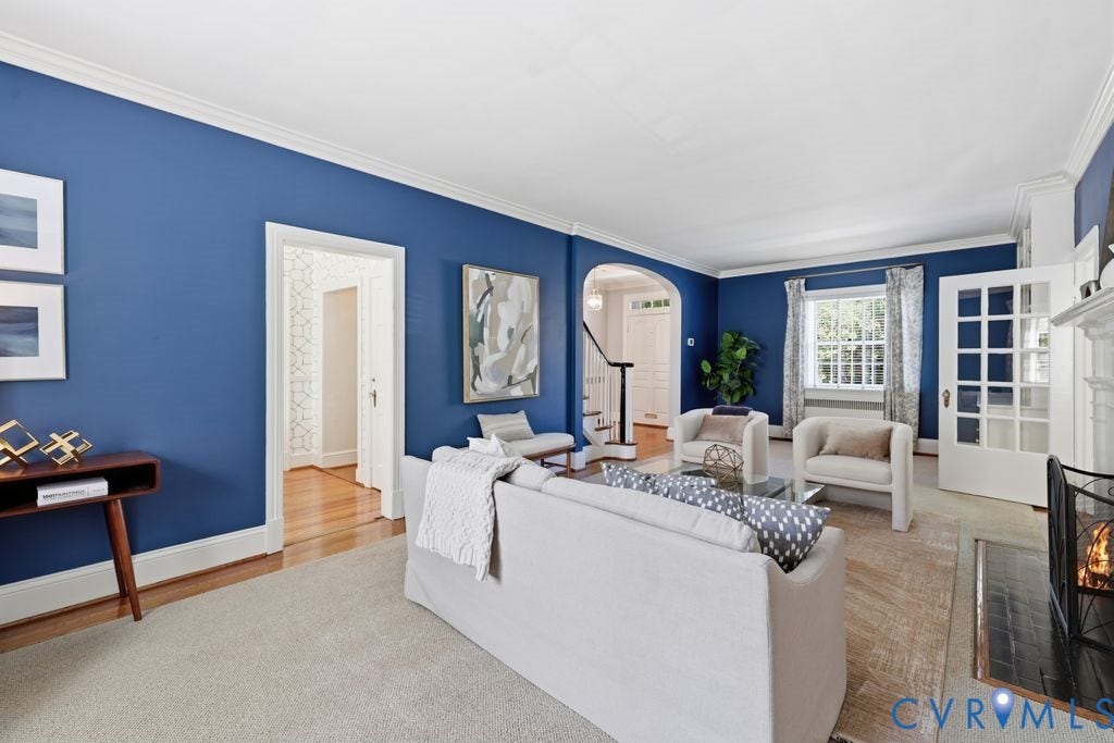 4117 W Franklin Street, Malvern Gardens, Richmond, VA 23221 Hardwood flooring, crown molding, white trim, arched doorway, and built-in fireplace