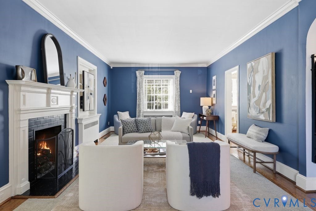 4117 W Franklin Street, Malvern Gardens, Richmond, VA 23221 Hardwood flooring, crown molding, white trim, recessed window, and a fireplace with a black tile surround