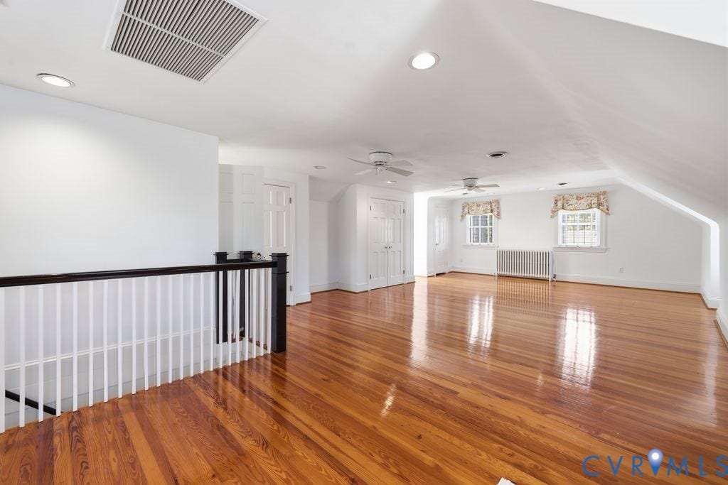 4117 W Franklin Street, Malvern Gardens, Richmond, VA 23221 Hardwood flooring, recessed lighting, white baluster railing, two ceiling fans, two panel doors