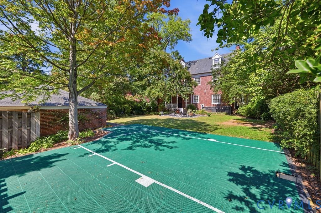 4117 W Franklin Street, Malvern Gardens, Richmond, VA 23221 Expansive green outdoor court with white markings, surrounded by mature trees