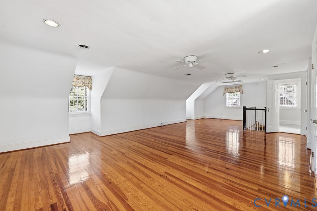 4117 W Franklin Street, Malvern Gardens, Richmond, VA 23221 Expansive space featuring wood-finish flooring, recessed lighting, and multiple windows