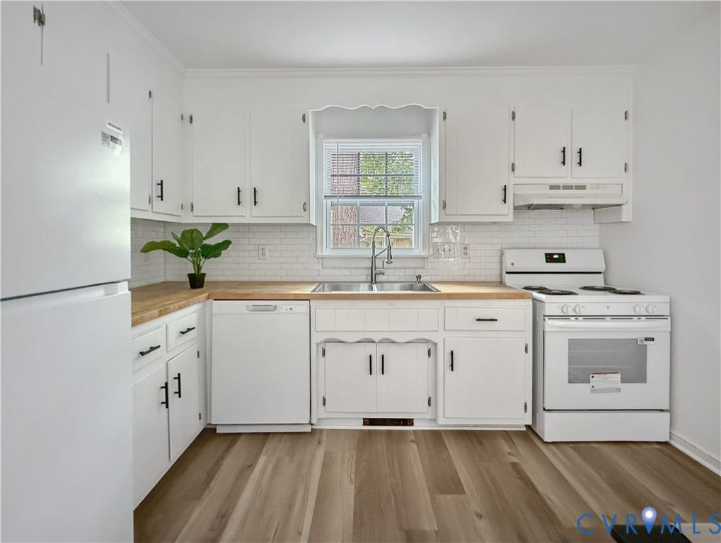 3203 Roland View Terrace, Chester, VA 23831 White cabinetry with matte black hardware, wood-finish countertops, subway tile backsplash, stainless steel sink, and wood-finish flooring