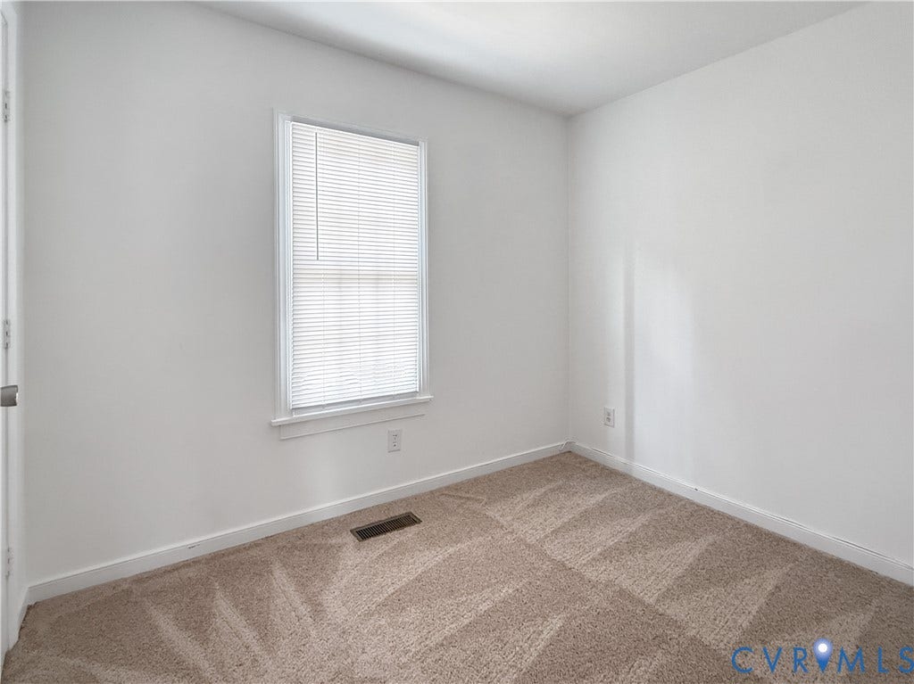 3203 Roland View Terrace, Chester, VA 23831 Neutral-toned patterned carpeting, white painted walls, and a window with horizontal blinds