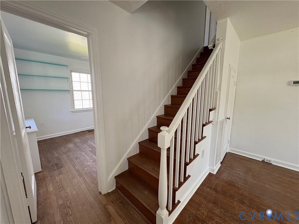 6211 Clover Lane, Lakeside, Henrico, VA 23228 Bright foyer showcasing a staircase with dark wood treads, white painted risers, and a white spindle railing