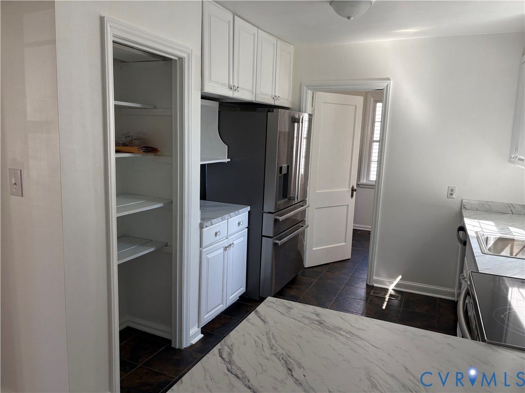 6211 Clover Lane, Lakeside, Henrico, VA 23228 Modern kitchen featuring white cabinetry, stainless steel appliances including a multi-door refrigerator, solid surface countertops, and dark hardwood flooring