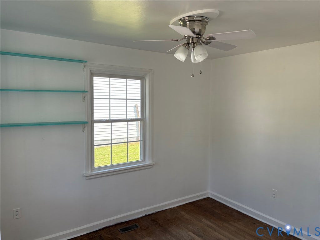 6211 Clover Lane, Lakeside, Henrico, VA 23228 Bright bedroom featuring hardwood flooring, ceiling fan with integrated lighting, and large double-hung window with plantation shutters