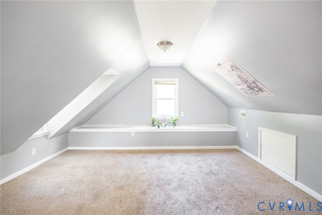 3505 Meadowbridge Road, Richmond, VA 23222 Carpeted room featuring sloped ceilings, a centered window with a built-in ledge, and recessed storage access