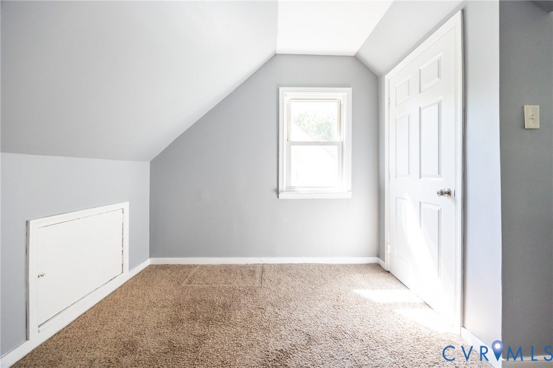3505 Meadowbridge Road, Richmond, VA 23222 Bright, light-filled bedroom with vaulted ceilings and dual closets featuring six-panel doors