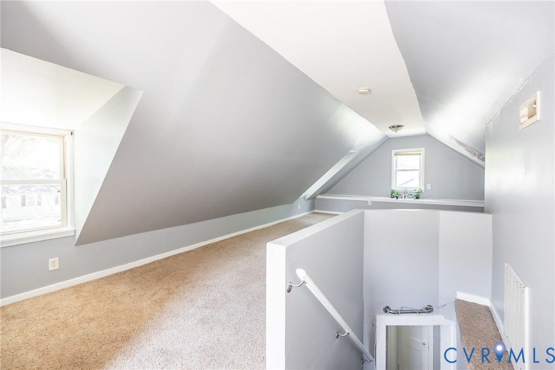 3505 Meadowbridge Road, Richmond, VA 23222 Finished attic space featuring sloped ceilings, abundant natural light from multiple windows, neutral wall finishes, and carpeted flooring