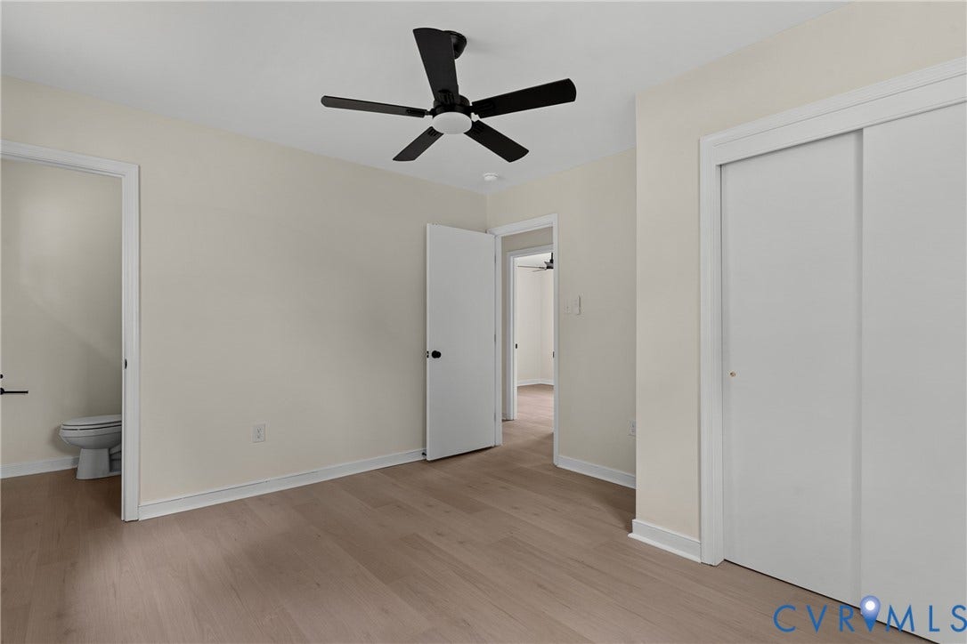 3924 Lamplighter Drive, Richmond, VA 23234 Interior room featuring light-toned walls, wood-finish flooring, and a black ceiling fan with integrated lighting