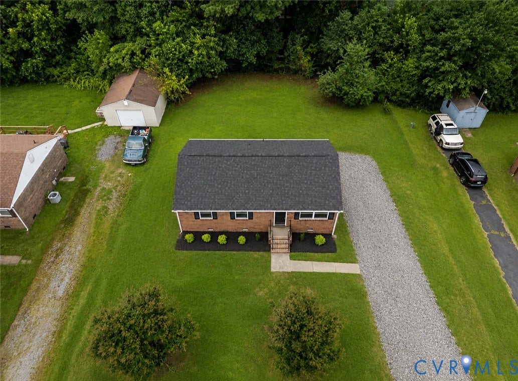 3924 Lamplighter Drive, Richmond, VA 23234 Brick exterior residence with a dark shingle roof and a gravel driveway
