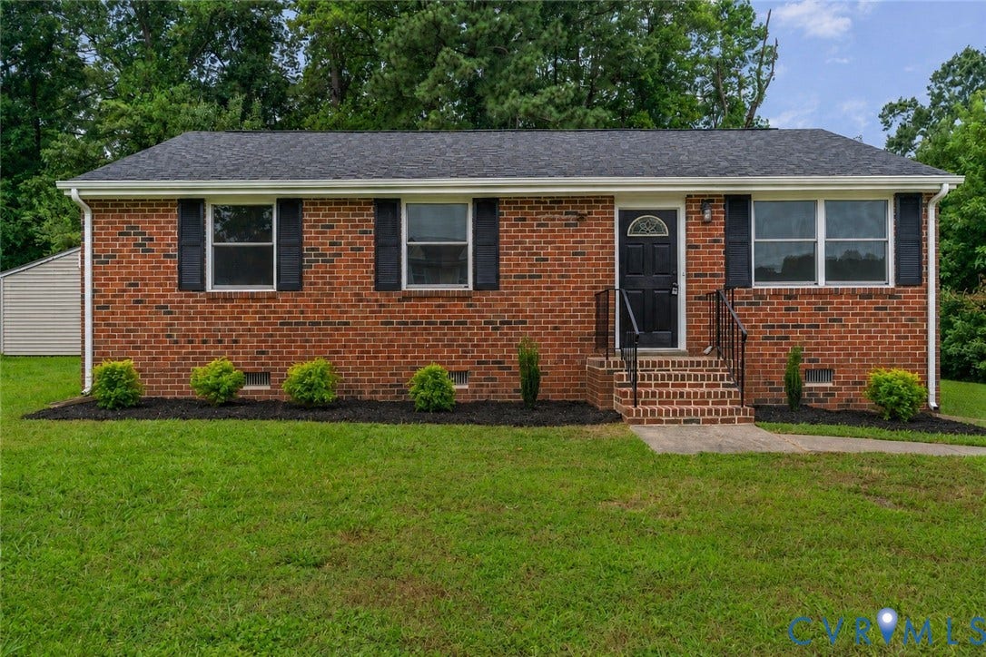 3924 Lamplighter Drive, Richmond, VA 23234 Brick exterior with black shutters and a complementary black front door