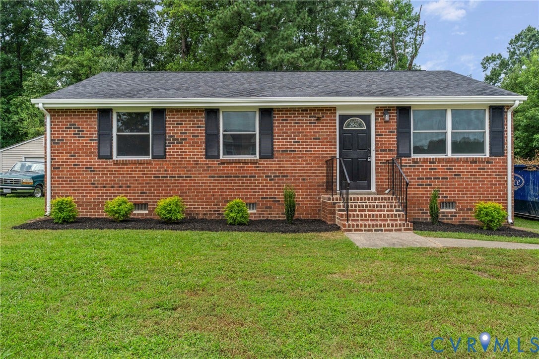3924 Lamplighter Drive, Richmond, VA 23234 Brick ranch-style facade with a dark shingle roof and white gutters