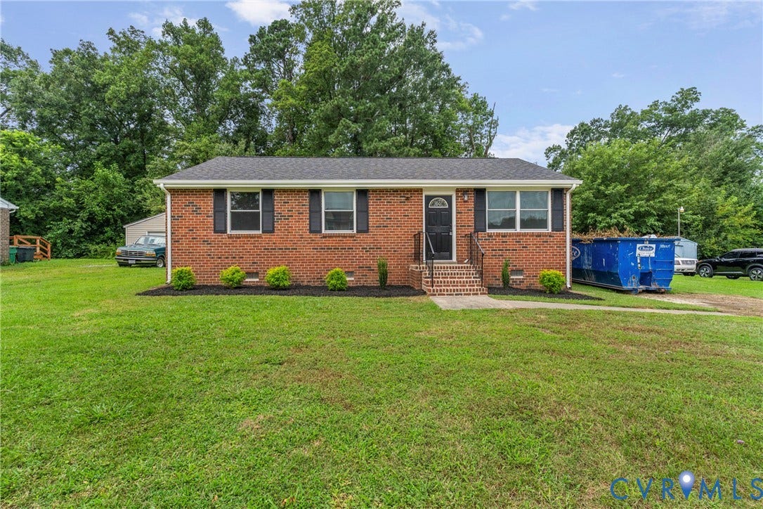 3924 Lamplighter Drive, Richmond, VA 23234 Brick exterior residence featuring a dark shingle roof and black window shutters