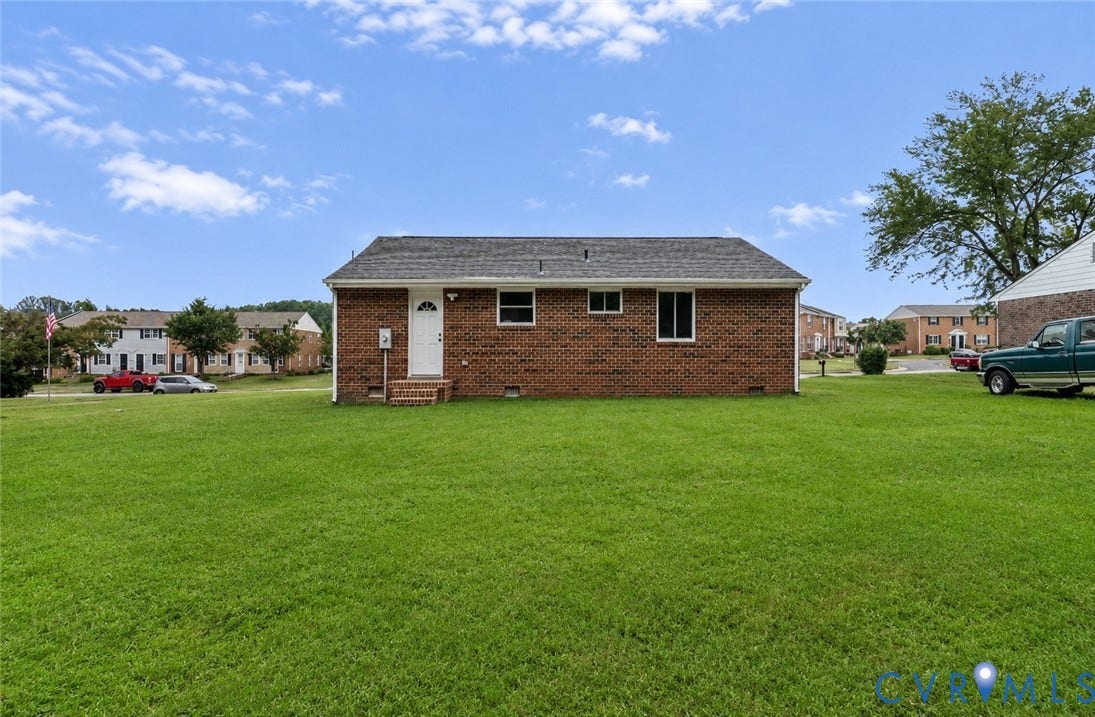 3924 Lamplighter Drive, Richmond, VA 23234 Expansive green lawn surrounds a brick exterior residence with a shingle roof