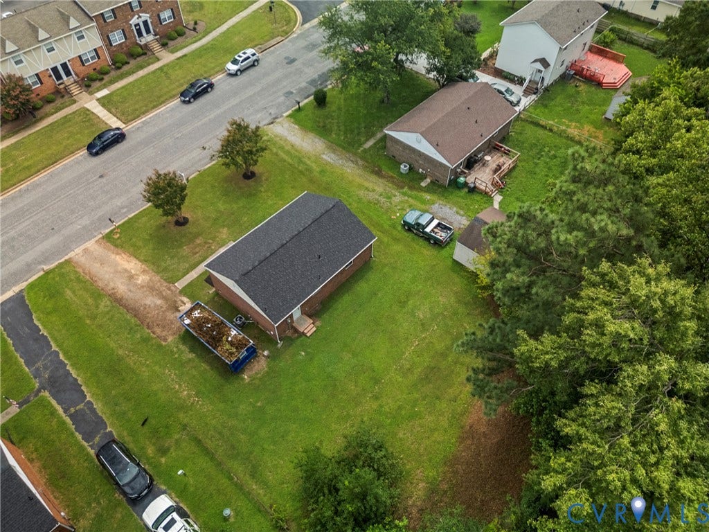 3924 Lamplighter Drive, Richmond, VA 23234 Brick-clad property with a dark shingle roof situated on a green lawn
