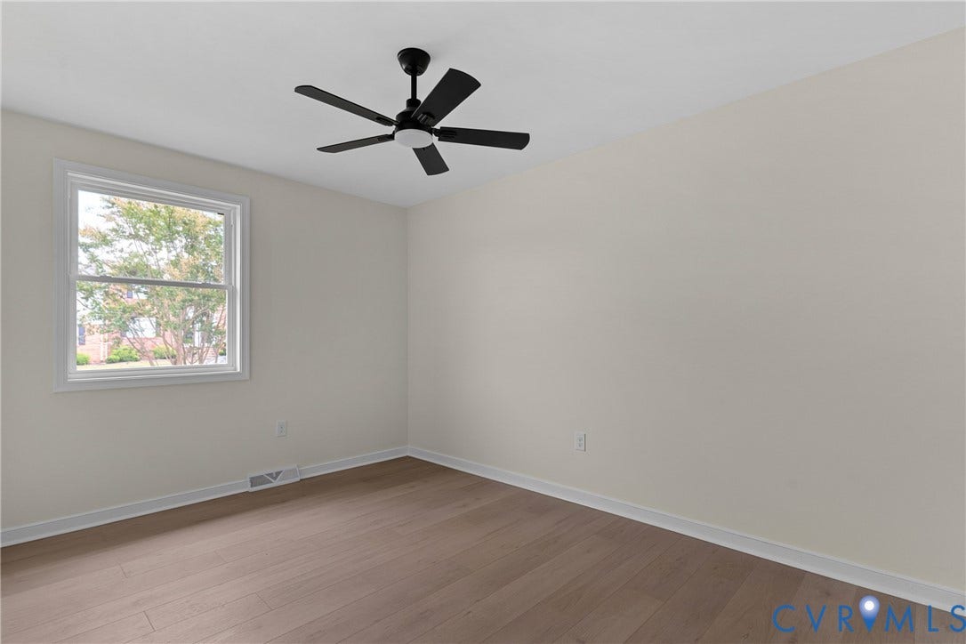 3924 Lamplighter Drive, Richmond, VA 23234 Room featuring wood-finish flooring, a white window frame, and a black ceiling fan with an integrated light