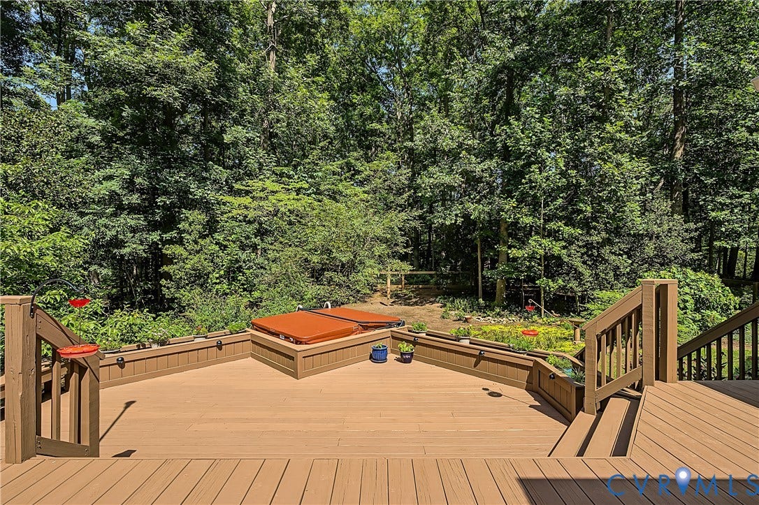 2431 Magnolia Ridge, Michael L Parrish, Maidens, VA 23102 Freshly painted three-tier deck with spa off of the screen porch, surrounded by lush forest