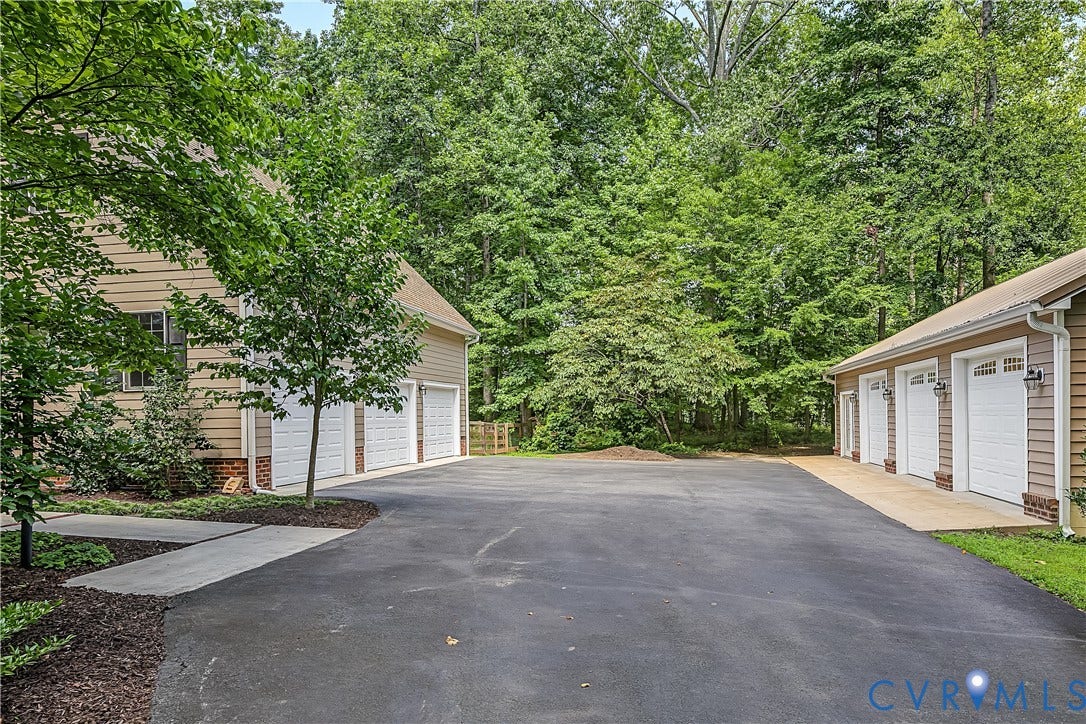2431 Magnolia Ridge, Michael L Parrish, Maidens, VA 23102 Offering a total of 6 separate garage bays, 3 attached and 3 detached.