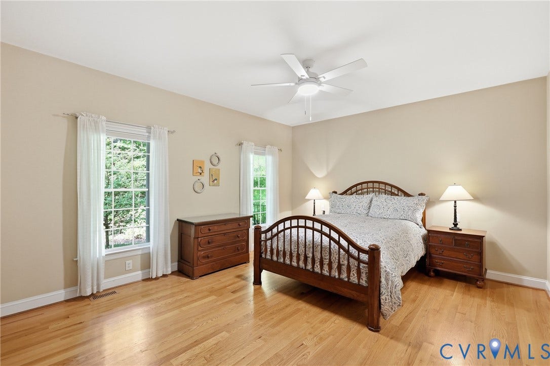 2431 Magnolia Ridge, Michael L Parrish, Maidens, VA 23102 Main-level primary suite with hardwood floors and serene views