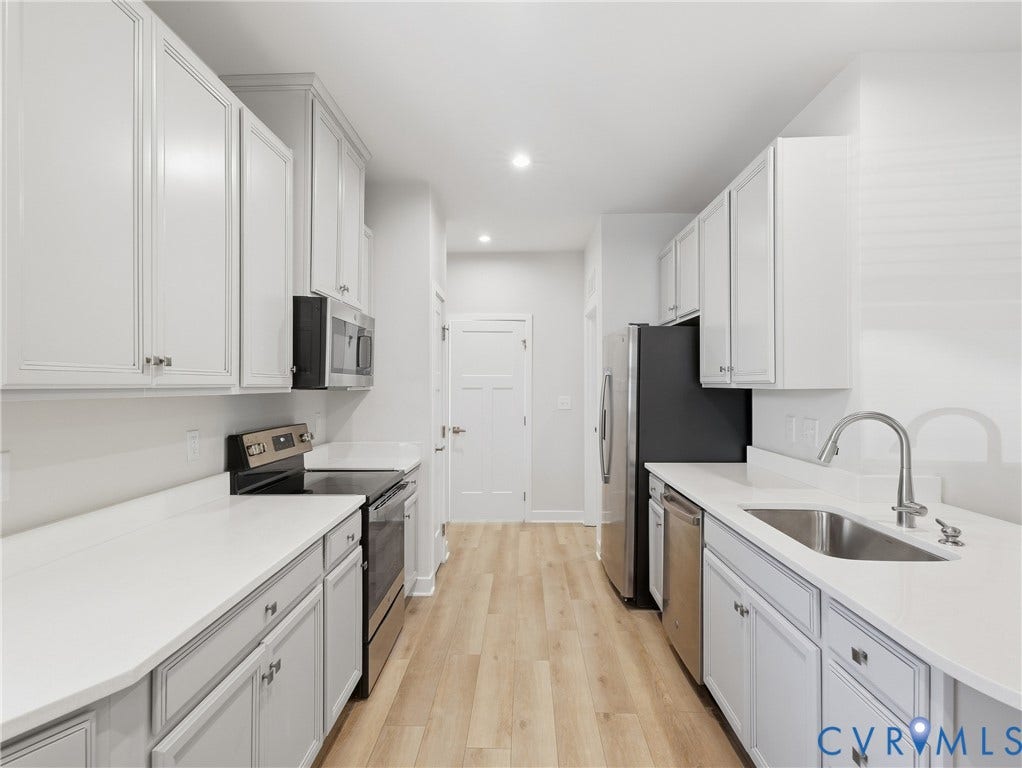 8060 Wistar Glen Drive, Henrico, VA 23228 Galley-style kitchen with stainless steel appliances and ample cabinetry