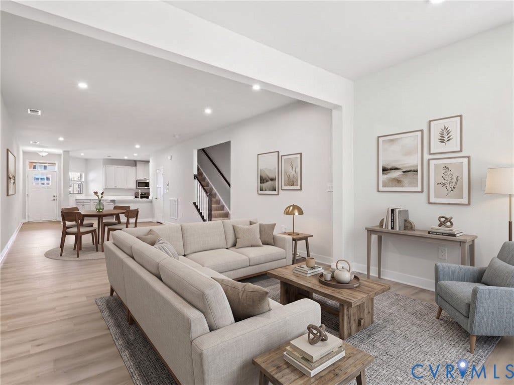 Open layout creates an easy connection between the living and dining spaces [Virtually staged for visualization purposes; actual room is unfurnished.]