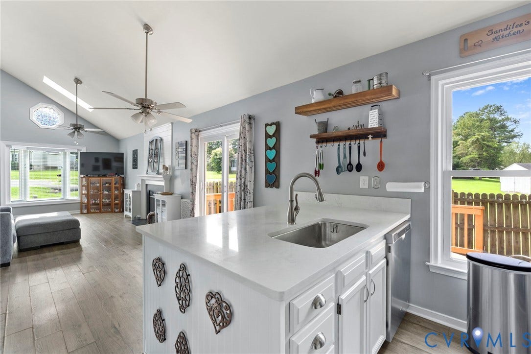 10138 Alberta Circle, Chesterfield, VA 23832 Kitchen island with an undermount sink and a stainless steel faucet