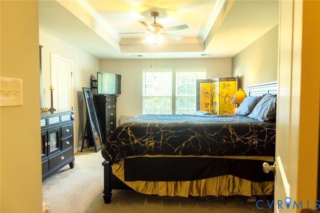 11617 Vicars Ridge Lane, Glen Allen, VA 23059 Recessed tray ceiling, ceiling fan with integrated lighting, double windows, and carpeted flooring