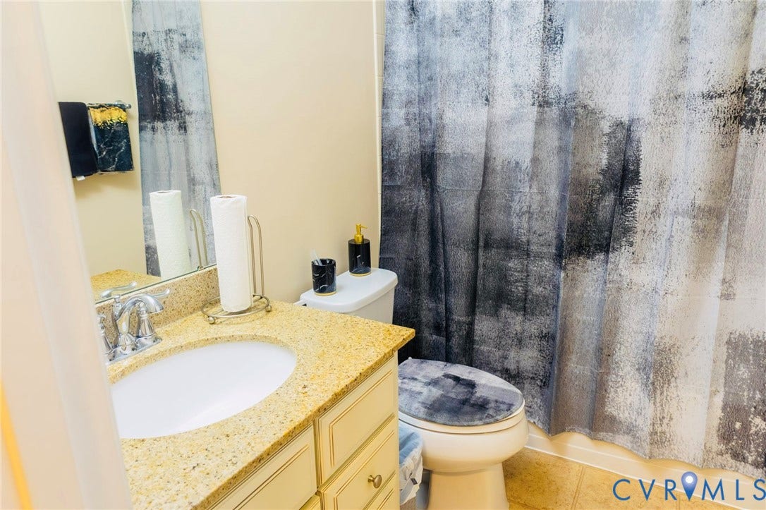 11617 Vicars Ridge Lane, Glen Allen, VA 23059 Bathroom vanity with a granite-style countertop, undermount sink, and chrome faucet
