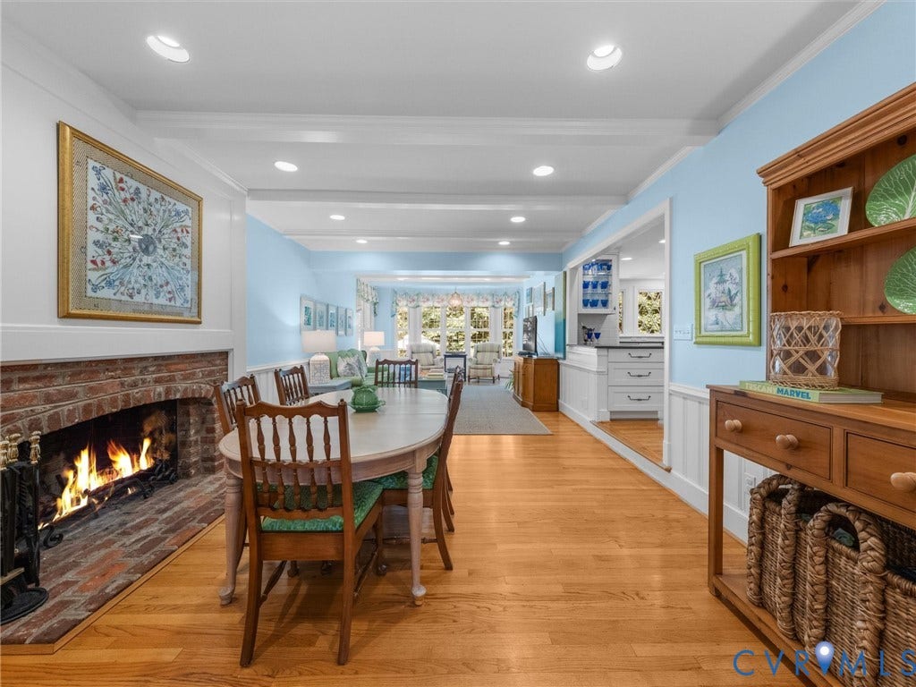 500 Kilmarnock Drive, Collegiate Area, Henrico, VA 23229 Hardwood flooring throughout, brick fireplace with hearth, recessed lighting, crown molding, and wainscoting