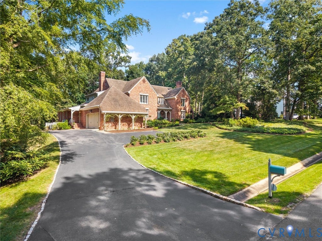 500 Kilmarnock Drive, Collegiate Area, Henrico, VA 23229 Brick exterior with a shingle roof and multiple gables