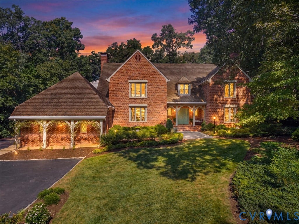 500 Kilmarnock Drive, Collegiate Area, Henrico, VA 23229 Brick exterior with a prominent front entrance, dormer windows, and an attached carport featuring decorative archways