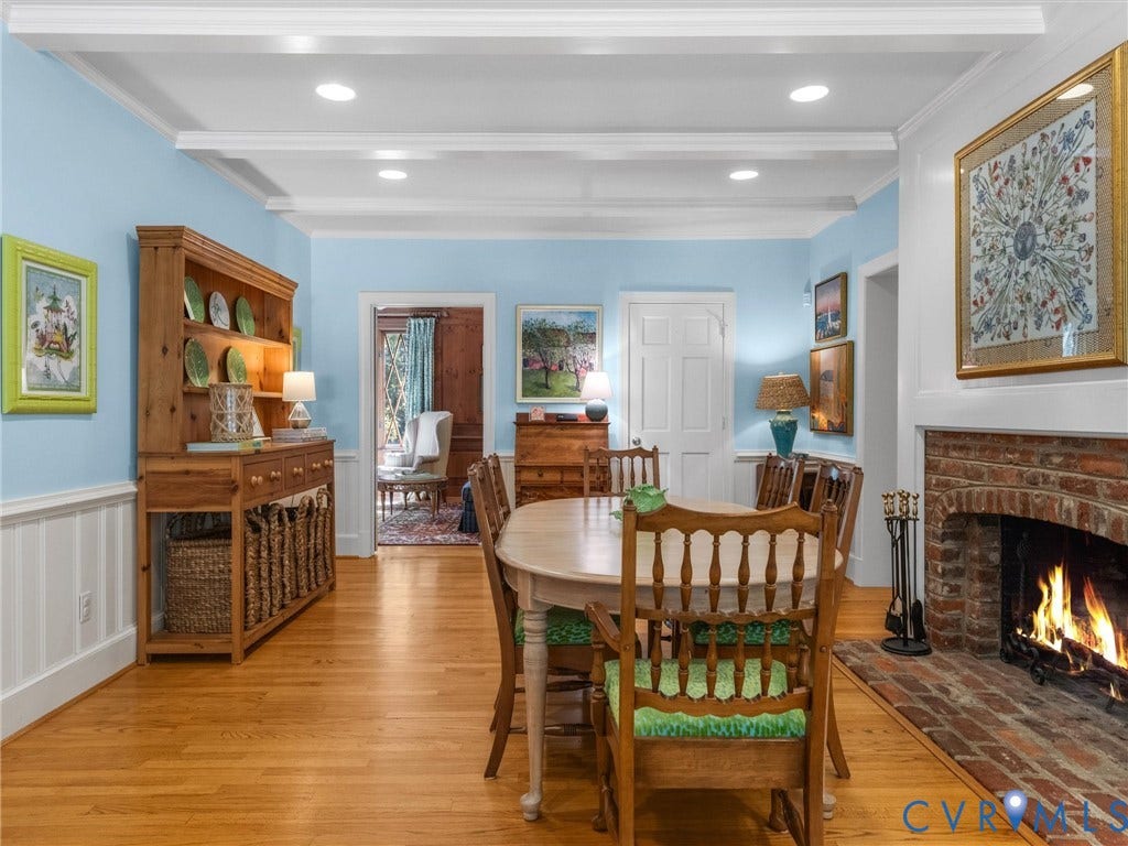 500 Kilmarnock Drive, Collegiate Area, Henrico, VA 23229 Hardwood flooring, brick fireplace with mantel, white wainscoting, overhead ceiling beams, and recessed lighting