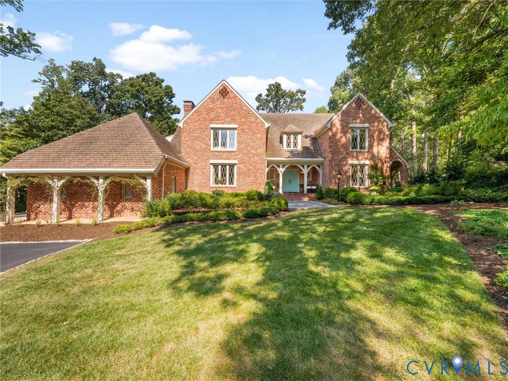 500 Kilmarnock Drive, Collegiate Area, Henrico, VA 23229 Brick exterior with an arched entry, prominent gables, and a columned porte-cochre