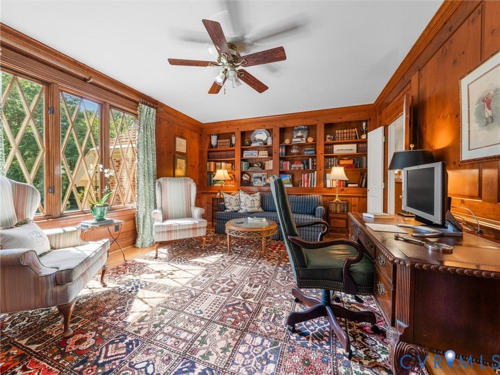 500 Kilmarnock Drive, Collegiate Area, Henrico, VA 23229 Wood-paneled room featuring built-in shelving, hardwood flooring, and a ceiling fan